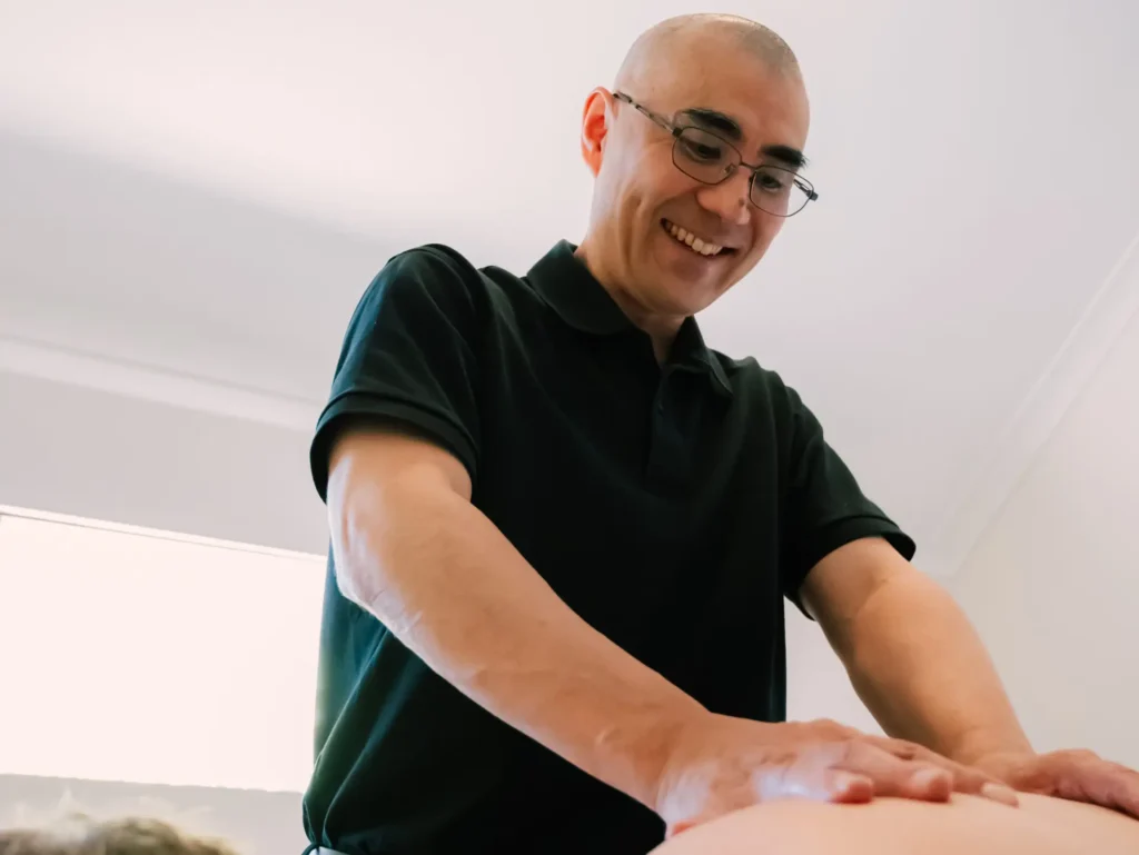 A physiotherapist providing hands-on treatment