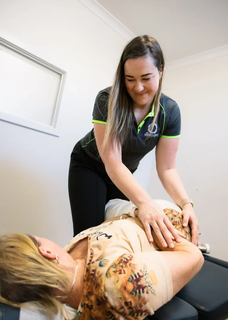 A Wellness Place practitioner treating a patient